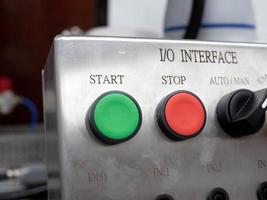 Button switch push power green start stop red pink color off on control icon symbol machine metal emergency energy technology danger safety equipment engine factory security element production photo