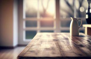 Abstract empty wooden desk table with copy space over interior modern kitchen room and window blurred background, display for product montage photo