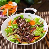 Salad with beef teriyaki photo