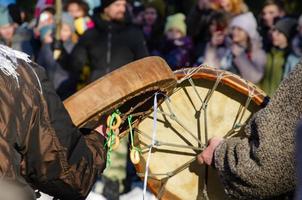 playing the big tambourine on a holiday photo