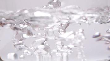 Close-up shot of boiling water on a gas stove. video