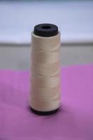 Spools of multicolor swings thread with Shallow depth of field photo