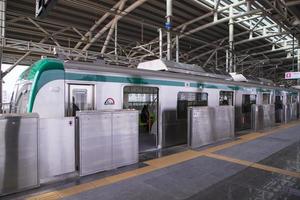 11 January 2023 Dhaka  Bangladesh The Dhaka Metro Mass Rapid Transit MRT High Speed electric train on the platform photo