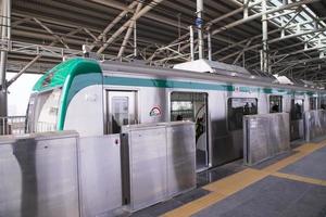 11 January 2023 Dhaka  Bangladesh The Dhaka Metro Mass Rapid Transit MRT High Speed electric train on the platform photo