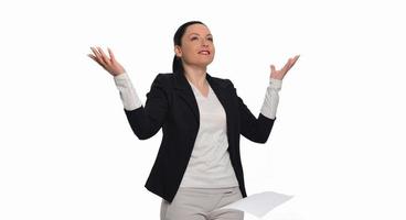 Business woman throwing work papers in the air. Stress from workload. photo