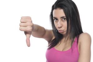 Young business arab woman isolated against a white background showing a dislike gesture, thumbs down. Disagreement concept. photo