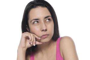 What, say louder, cannot hear you. Confused intense and annoyed woman in pink t-shirt, gesturing palm cluelessly, holding hand near ear photo