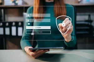 Cyber security concept, Login, User, identification information security and encryption, secure access to user's personal information woman using smart phone and tablet in office photo