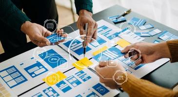UX graphic designer planning application process development prototype wireframe for web smart phone. Creative digital development agency. with VR icon photo