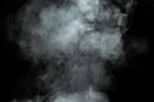 Abstract  powder or smoke isolated on black background photo