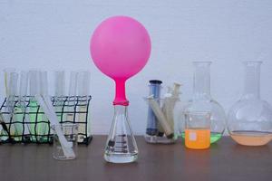 Science experiment , pink inflated balloon  on top of transparent test bottle. The experiment about air or gas reaction.by using baking soda and vinegar.Concept,  Science Education photo