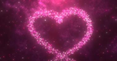 Glowing purple love heart made of particles on a purple festive background for Valentine's Day photo