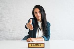 Young caucasian brunette business woman director in office photo