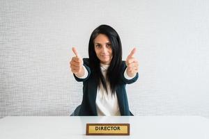 Young caucasian brunette business woman director in office photo