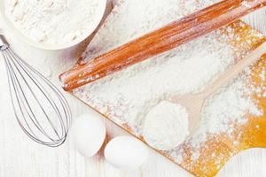 Baking ingredients on white wooden background photo