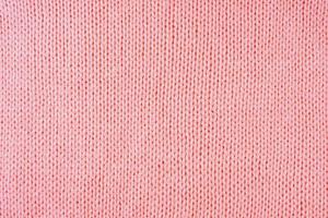 Bright red knitwear wool fabric texture background. Abstract textile backdrop photo