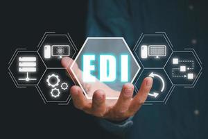 EDI, Electronic data interchange concept, Person hand holding Electronic data interchange icon on virtual screen. photo