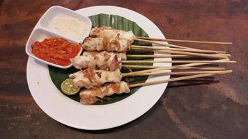 Chicken grilled satay skewers photo