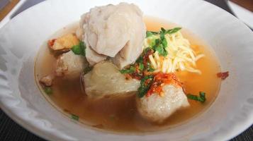 Bakso. Indonesian beef meatball served with noodles and tofu photo