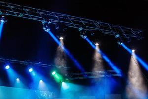 Illuminated empty concert stage with smoke photo