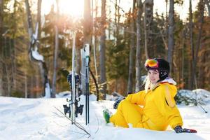 Woman skier enjoy in winter sunny day, holiday photo
