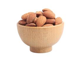 Almonds in a wooden cup on a white background photo