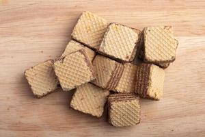 Cube wafer with chocolate cream on isolated white background photo