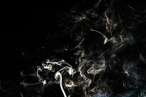 Smoke effect texture. Isolated background. Black and dark backdrop. Smokey fire and mistic effect. photo