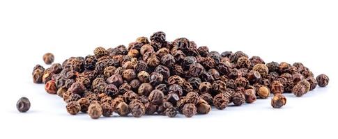 Hill of black pepper isolated on white background. Aromatic black pepper. photo