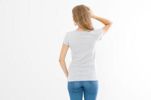 Woman in template blank t shirt isolated on white background. Back view. Mock up. Copy space. photo