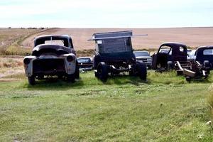 old trucks in a field photo