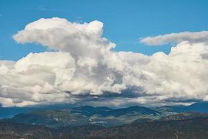 Beautiful view of cumulus clouds over old mountains in Antalya on the Aegean coast, idea for a background, travel and vacation story photo