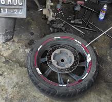 Sidoarjo, Jawa timur, Indonesia, 2023 - motorcycle rear tire repair photo