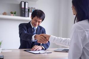 Business men handshake to enter into a business negotiation contract happy with work Connection Concept. photo