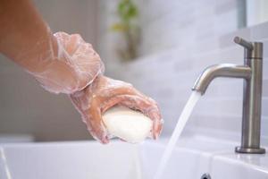 Wash your hands and rub with soap for at least 20 seconds to prevent the corona virus or Covid-19. Stop the spread of the corona virus and for good hygiene. photo