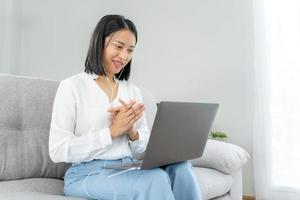 Online job interview. Asian businesswoman is being interviewed for a job with an executive via video call. Talk about past work experience and competence in the position. resume or personal record photo