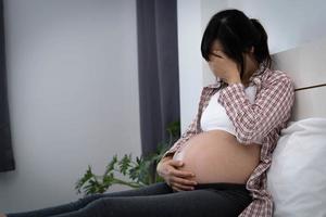 Pregnant women suffer from depression. The woman was disappointed and sad. photo