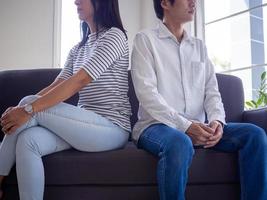 Asian couples are bored, sit back and don't say anything. After a violent argument. photo