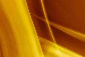 fondo abstracto marrón dorado de la intersección de los rayos. foto