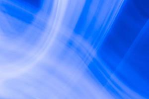 Abstraction of white waves of tench on a blue background photo