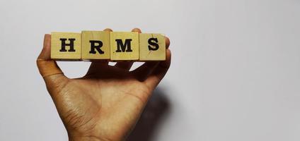 HRMS Human Resource Management System on wooden cubes photo