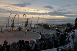 Kecak dance performance on Melasti Beach, bali, Indonesia photo