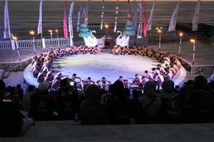 Kecak dance performance on Melasti Beach, bali, Indonesia photo