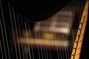 harp strings detail close up isolated on black photo