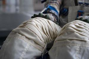 Astronaut space suit gloves close up photo
