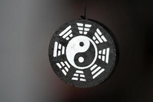 Yin Yang symbol pendant isolated photo