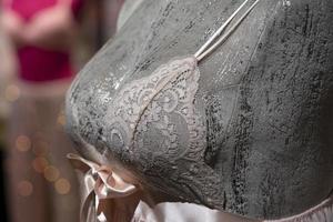 woman bra on a mannequin inside a shop photo