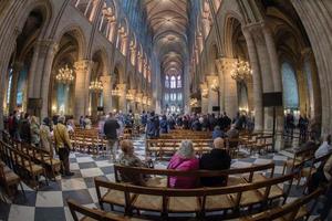 PARIS, FRANCE - MAY 1, 2016 - Notre Dame Cathedral crowded for sunday mass photo