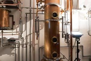 Copper still alembic inside distillery photo