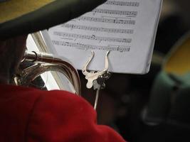 hands playing bass tuba detail photo